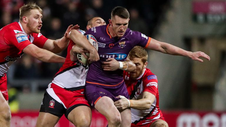 Lee Gaskell tries to find a way through the Salford defence