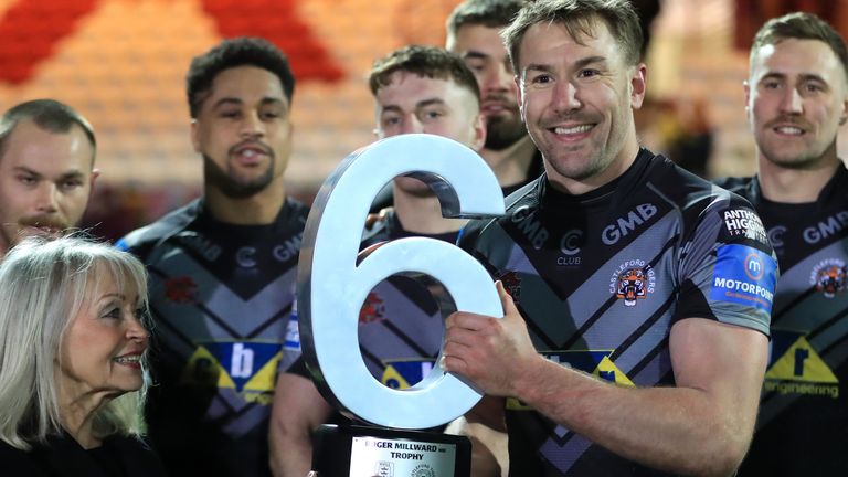 Castleford captain Michael Shenton is presented with the Roger Millward Trophy