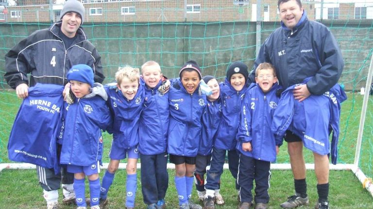 McCallum (C) pictured with team-mates and coaches during his time at Herne Bay Youth FC