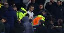 Dier climbs into stand to confront fans