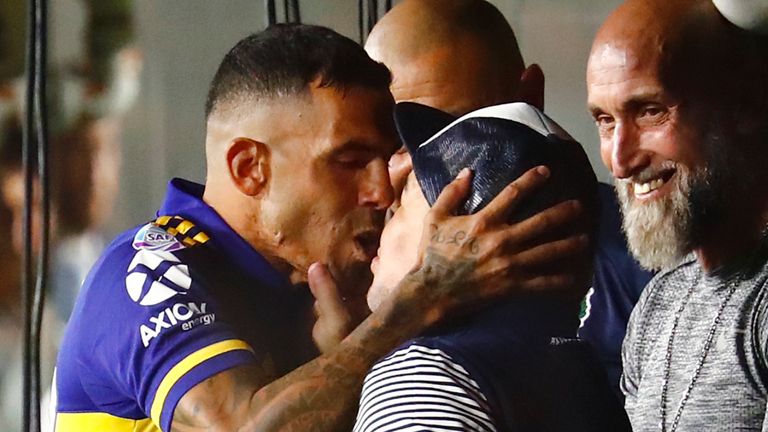 Carlos Tevez kisses Diego Maradona before he scored the winner to seal this season's title for Boca Juniors in March