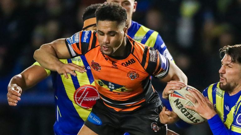 Castleford's Derrell Olpherts is tackled by Warrington's Gareth Widdop