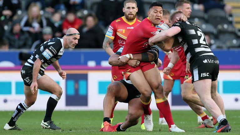 Israel Folau is wrapped up by the Hull FC defence