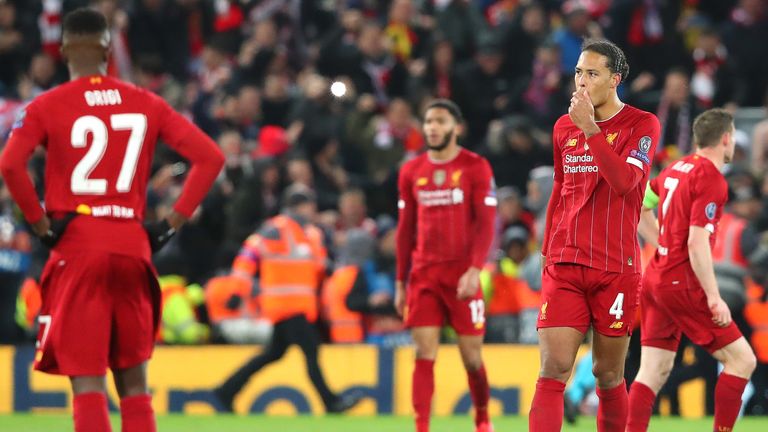 Virgil van Dijk looks on after Liverpool are knocked out of the Champions League by Atletico Madrid