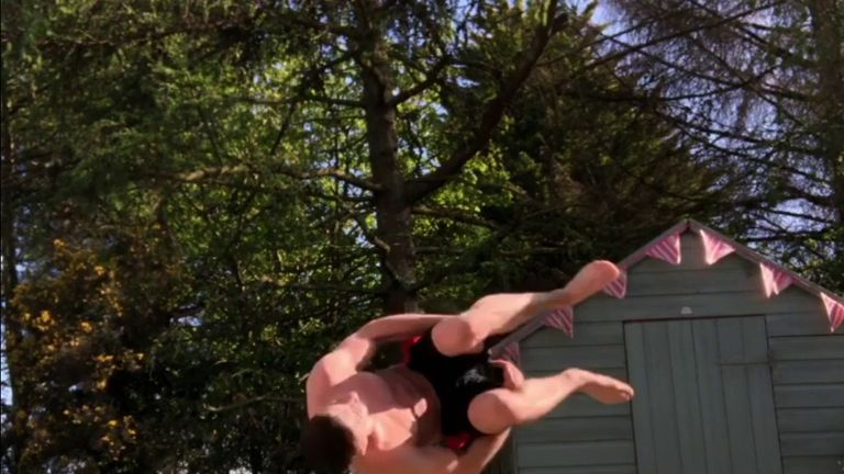 Gymnast Rhys McClenaghan's training includes back flipping over his dog Finn.