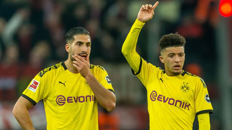 Emre Can (L) says Jadon Sancho (R) needs guidance