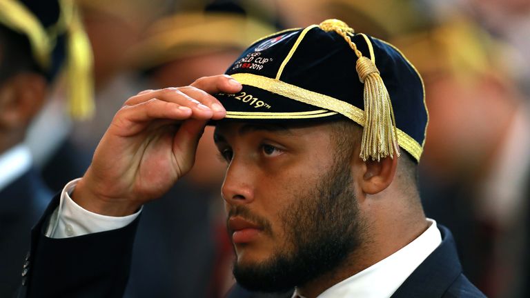 Ludlam wears his 2019 World Cup cap during the England Welcome Ceremony