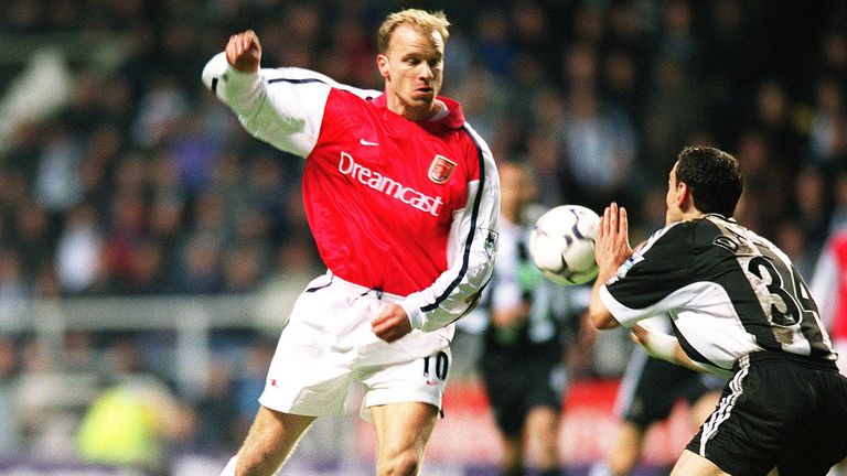 Bergkamp flicks the ball around Newcastle United defender Nikos Dabizas