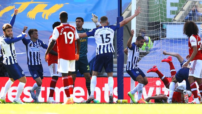 Lewis Dunk bundles the ball over the line to score Brighton's equaliser