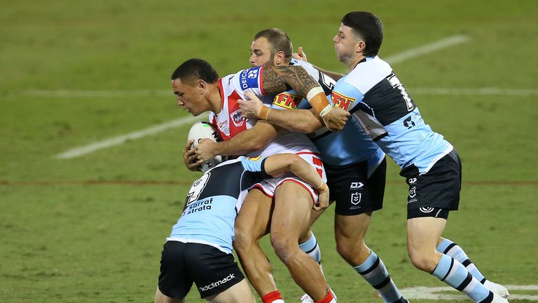 Tyson Frizell  is wrapped up by the Sharks defence