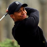 Tiger Woods leads by a shot at the halfway stage