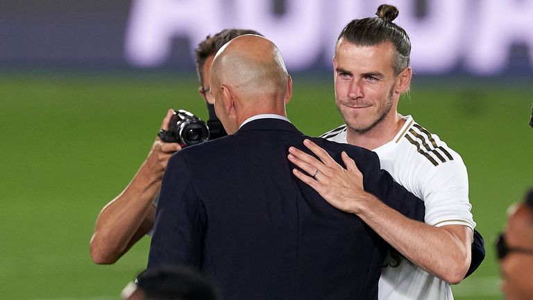 Zinedine Zidane and Bale embrace during Real Madrid's title celebrations