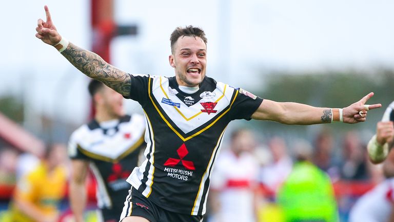 Gareth O'Brien celebrates kicking the golden point drop goal which kept Salford in Super League