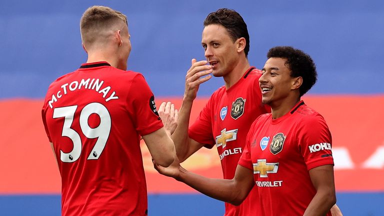 Jesse Lingard celebrates with teammates after doubling Manchester United's lead against Leicester on the final day of the Premier League season