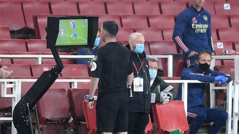 Chris Kavanagh used the pitchside monitor before sending off Arsenal's Eddie Nketiah