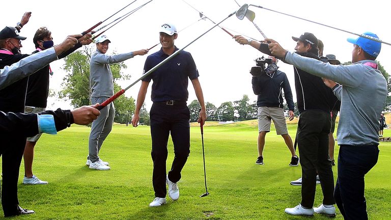 Renato Paratore wins the British Masters and celebrates with his mother via a Sky Sports iPad before being given a guard of honour by several players as he left the green