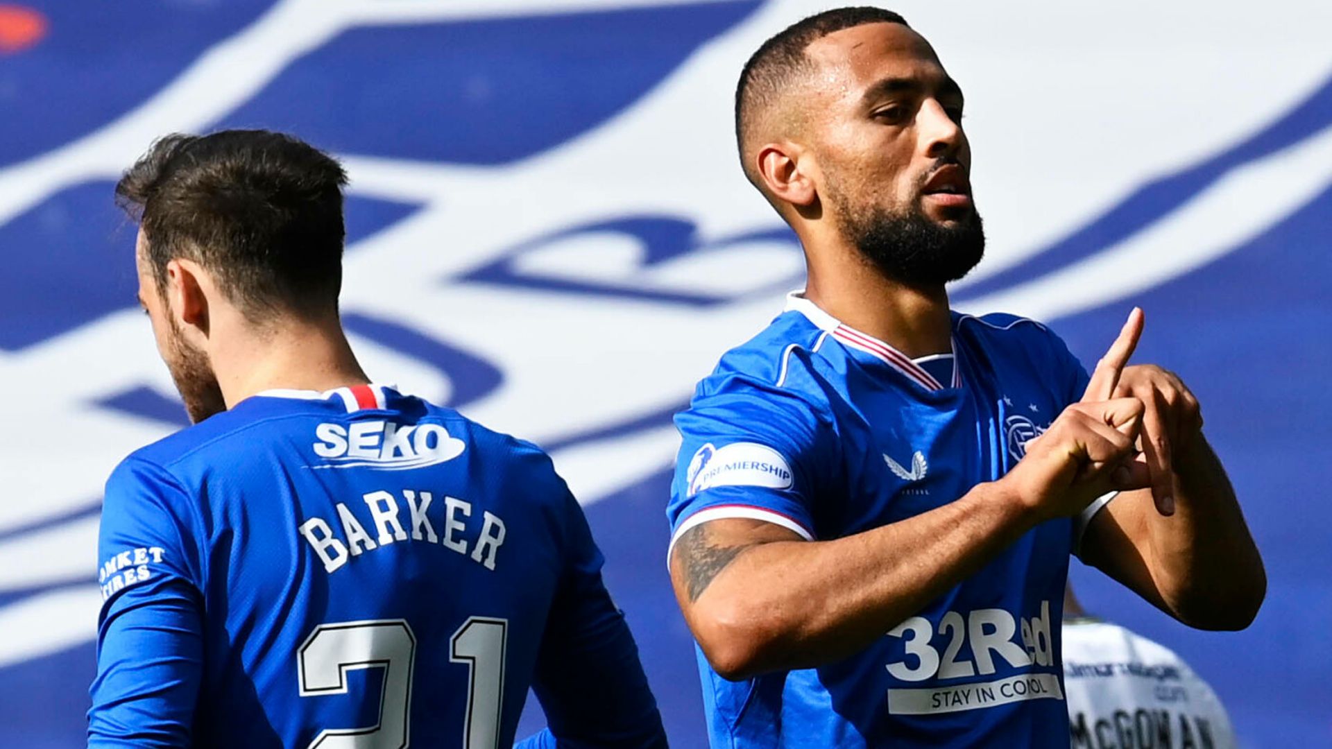 Roofe helps send Rangers clear at summit