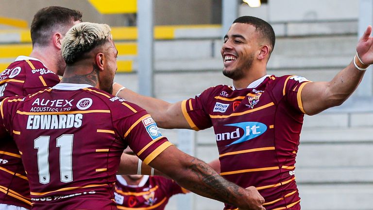 Darnell McIntosh celebrates one of his tries against Leeds