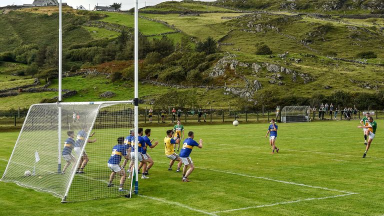 Michael Murphy takes a shot on goal with several Kilcar players on the line
