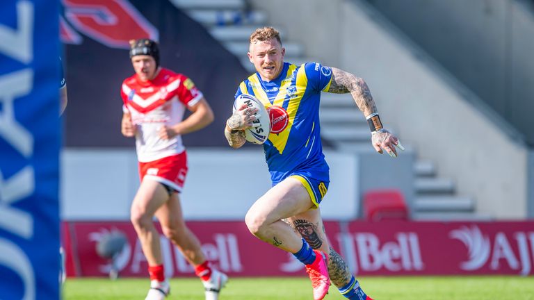 Warrington's Josh Charnley breaks through the St Helens defences to score a try