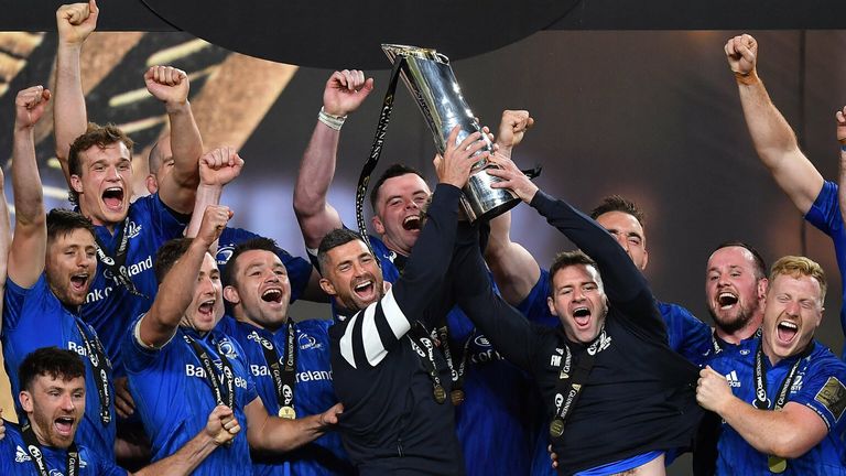 Departing Leinster players Rob Kearney and Fergus McFadden lift the PRO14 trophy after a third title success in a row for the province
