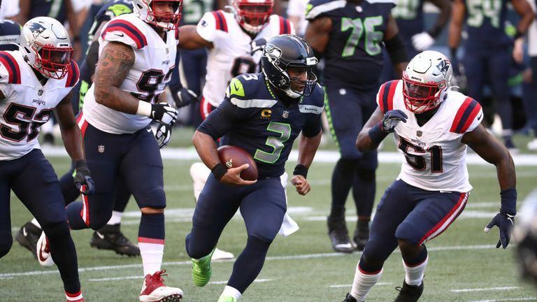 Cam Newton of the New England Patriots throws the ball in the second