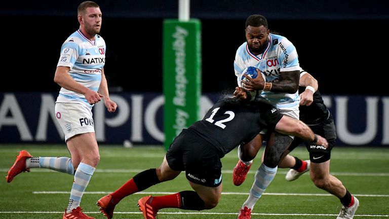 Racing's Virimi Vakatawa is tackled by Brad Barritt