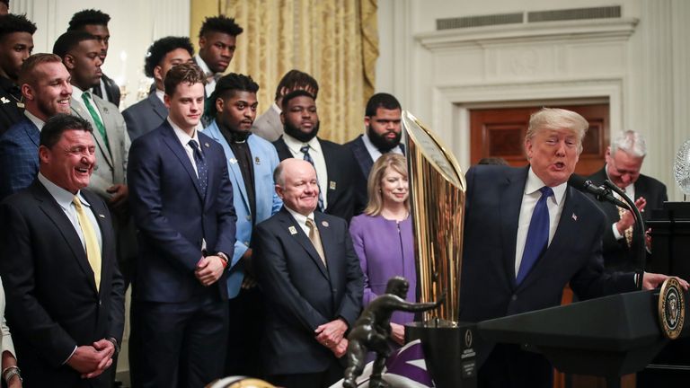 Trump speaks during an event to honour this year's NCAA football champions Louisiana State University Tigers in the White House in January 