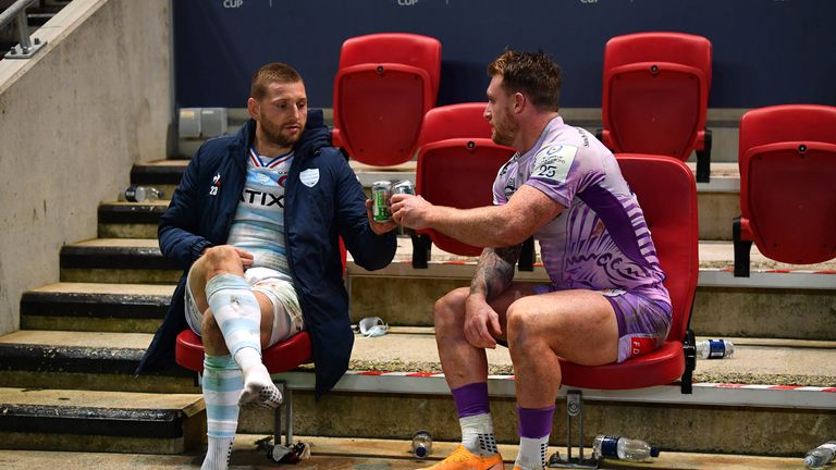 Russell (L) and Stuart Hogg share a beer after the Champions Cup final