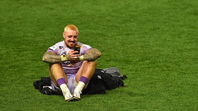 Jack Nowell also takes a moment on his phone after the win