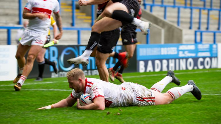 Jordan Abdull slides in for one of Hull KR's tries against Salford