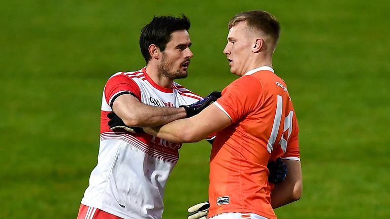 Chrissy McKaigue of Derry and Rian O'Neill of Armagh tussle during the contest