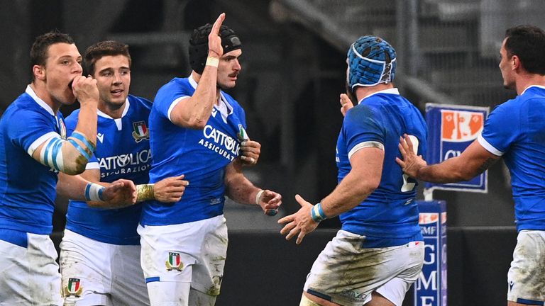 Carlo Canna celebrates his first-half try which put Italy ahead