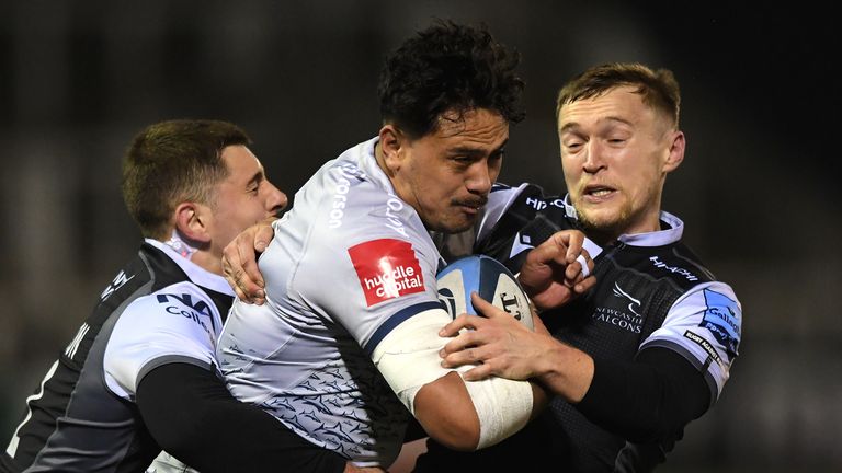 Falcons players Ben Stevenson (L) and Brett Connon combine to tackle Sale wing Denny Solomon