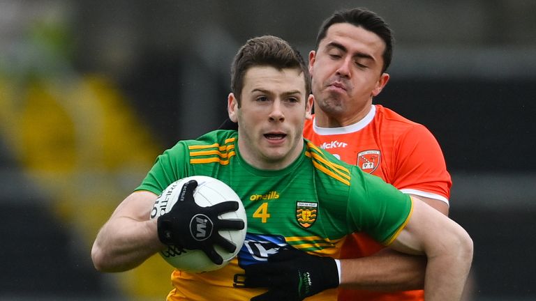 Eoghan Bán Gallagher of Donegal in action against Stefan Campbell of Armagh