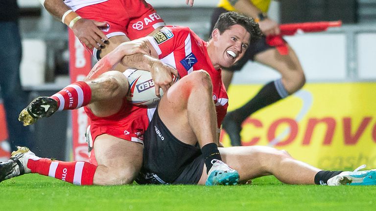 Coote celebrates having scored the opening try, with Catalans reduced to 12 men 