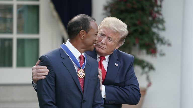 Trump gives golfer and business partner Tiger Woods the Medal of Freedom in May 2019 in a Rose Garden ceremony at the White House