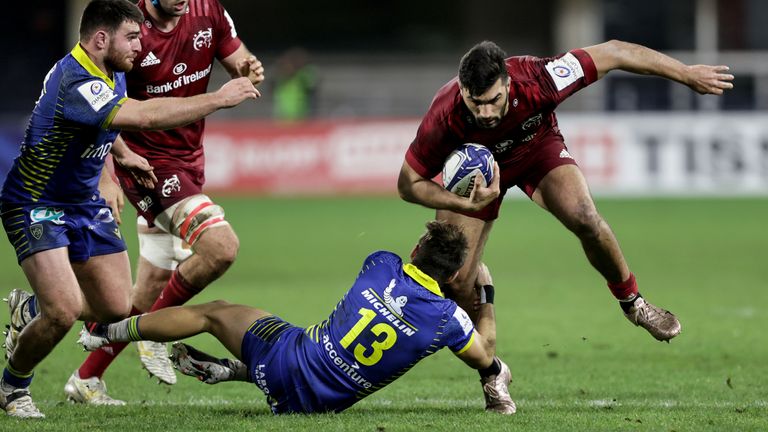 Munster's Damian de Allende is tackled by Jean-Pascal Barraque 