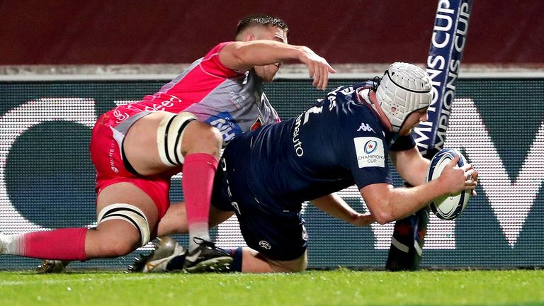 Maxime Lamothe dives across the line 