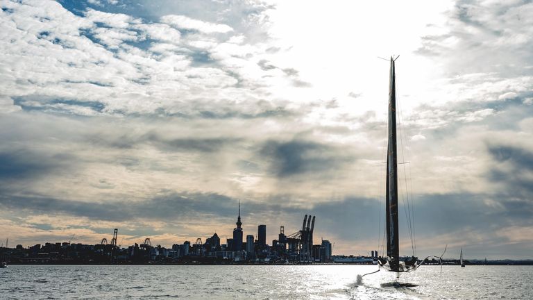 A beautiful image of INEOS TEAM UK's race boat BRITANNIA on the water in Auckland (Credit: Harry KH)