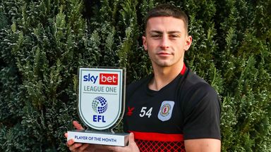 Owen Dale displays his Player of the Month trophy