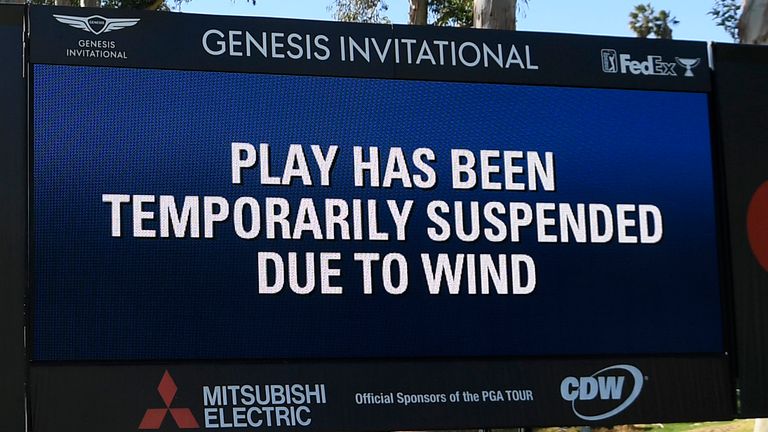 Play was stopped for three hours and 54 minutes due to winds gusting around 40 miles per hour