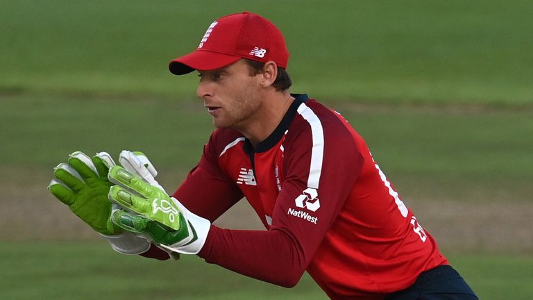 Jos Buttler collects a throw during England's third T20 international against South Africa