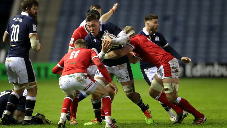 Scotland's Matt Fagerson is tackled by Wales' Aaron Wainwright 