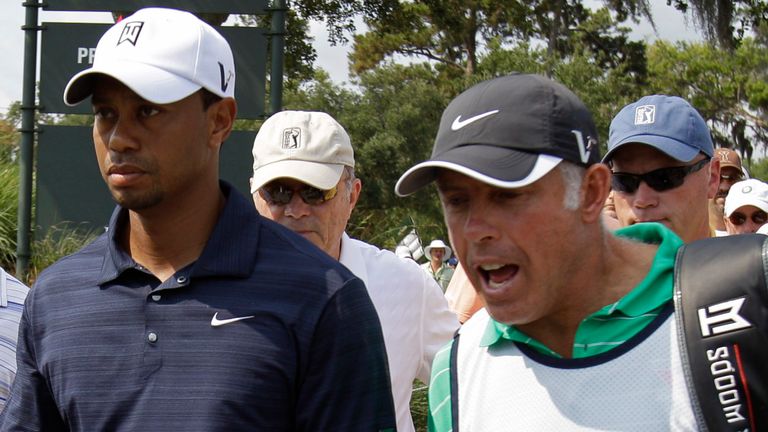 Woods walked off the course with his caddie, Steve Williams, during the opening round