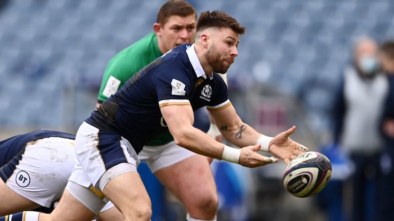 Ali Price passes the ball as Tadhg Furlong watches on