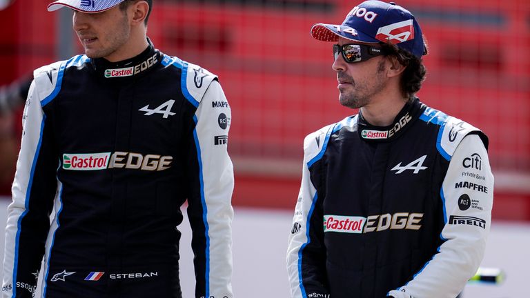 Fernando Alonso is back in F1, pictured in Alpine overalls next to Esteban Ocon