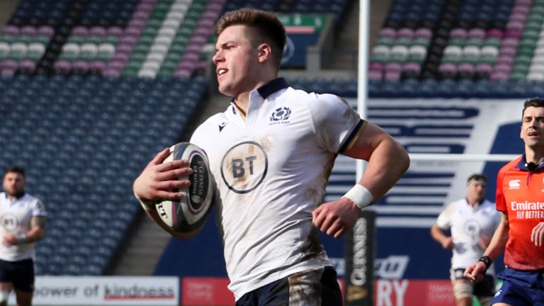 Scotland's Huw Jones runs through to score their fourth try 