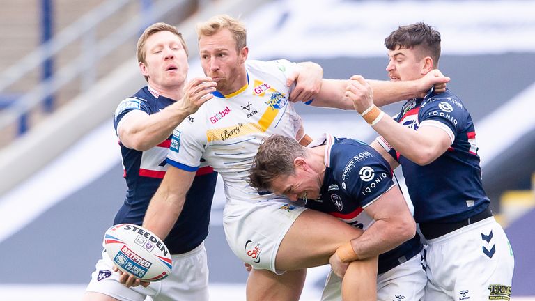 Leeds's Matt Prior is tackled by Wakefield's Chris Green, Matty Ashurst & Jordan Crowther.