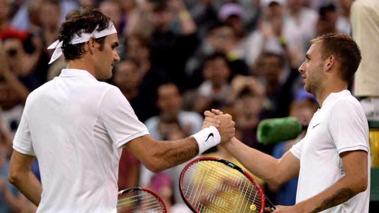 Dan Evans (right) will face Federer in round two